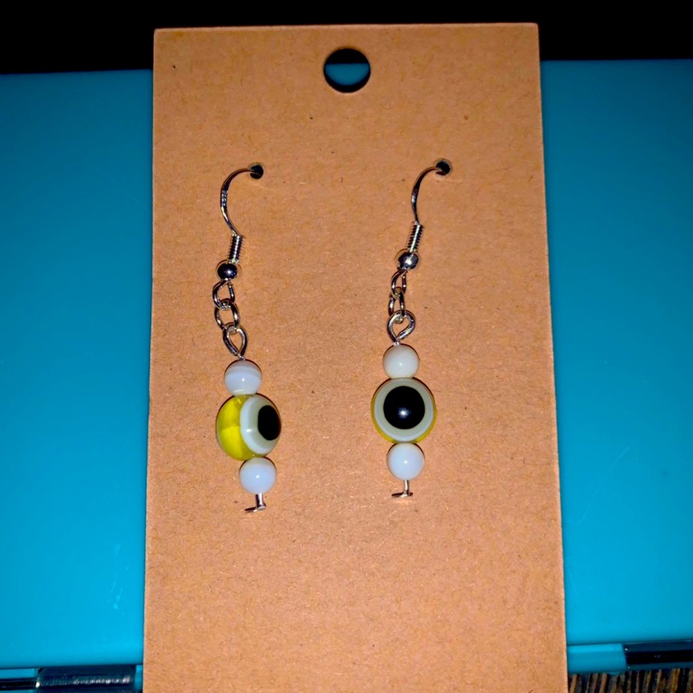 Yellow evil eye dangle earrings